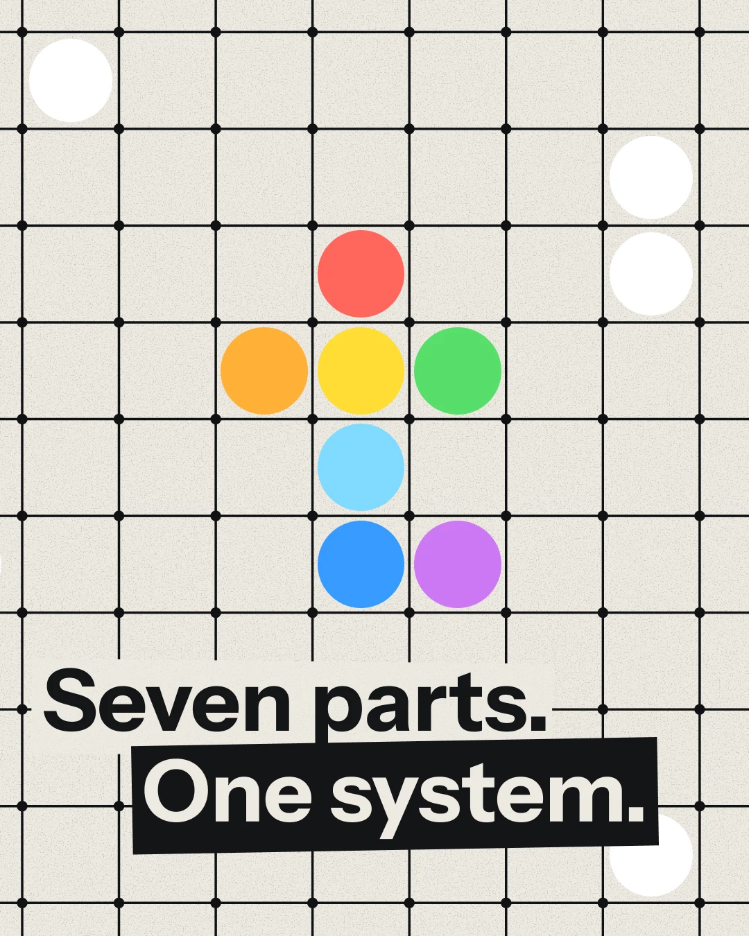Seven parts. One system. The seven coloured blocks of the t on a cream lattice.